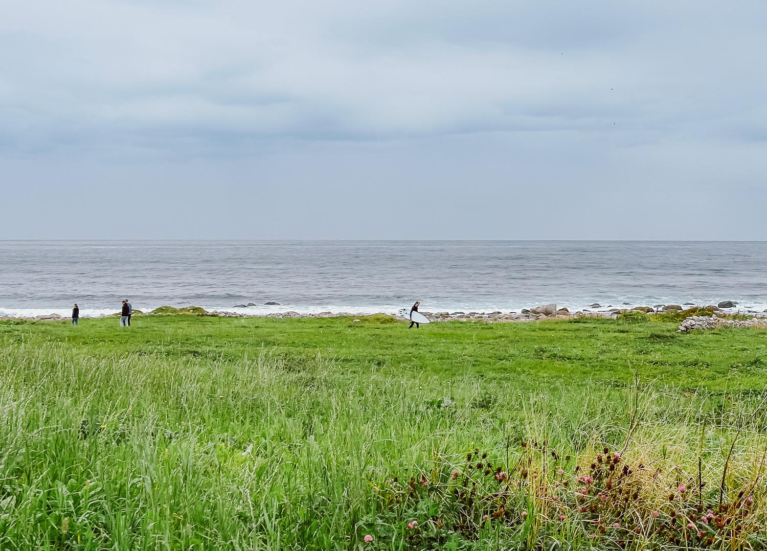 surfers at Alnes lighthouse